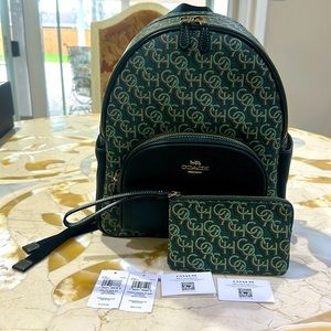 100% Authentic Coach logo backpack with matching wristlet.